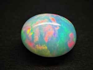 Cabujón de Ópalo Etíope de 8x6mm - Gema Suelta de Forma Ovalada con Múltiples Destellos - Gemas de Ópalo Lisas con Destellos Arcoíris - Product Image 4