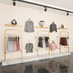 Exhibidor de Ropa de <span class=keywords><strong>Metal</strong></span> Dorado Personalizado para Tiendas, Exhibidor de Ropa de Acero Inoxidable para Pared - Product Image 3