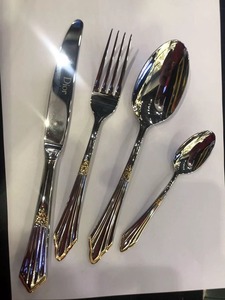 Luxury <b>silver</b> stainless steel flatware set featuring embossed <b>ornate</b> scroll handles and <b>mirror</b> polished heads displayed - Product Image 4