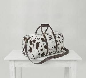Sac de voyage en cuir véritable à imprimé vache en poils de veau, avec bandoulière amovible, style chasse unisexe, fermeture éclair - Product Image 1