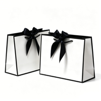 Sacs cadeaux élégants en papier noir et blanc avec nœud en satin, pour bijoux de luxe ou cadeaux de mariage, utilisables en supermarché