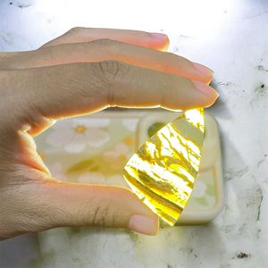 อำพันสุมาตราสีน้ำตาลทองโปร่งแสง ขนาด 40x25 มม. รูปทรงอิสระ แบบคาโบชอง ขัดเงาอย่างเป็นธรรมชาติ สำหรับงานประดับตกแต่ง - Product Image 5