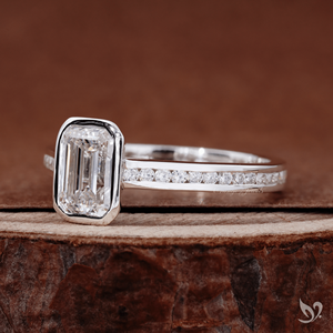 Sleek emerald cut 1ct lab grown diamond ring with bezel <b>frame</b> and channel band in 10k white gold - Product Image 3
