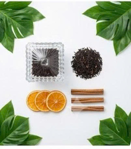 Infusion de thé noir à la cannelle et à l'orange avec tranches d'orange séchées et bâtonnets de cannelle dans un verre, marque NMPT, bon prix - Product Image 5
