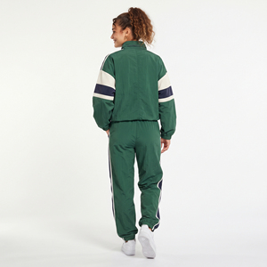 Ensemble de survêtement sportif coupe ample avec fermeture éclair sur le côté, coupe-vent, 100 % polyester et nylon respirant, pantalon et veste, fabrication OEM personnalisée - Product Image 2