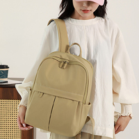 Sac à dos décontracté unisexe beige géométrique en polyester avec fermeture éclair, grande capacité 36-56L, poches avant, idéal pour l'école, les voyages et le quotidien des étudiants