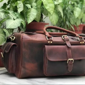 กระเป๋าเดินทางหนังแท้ จำหน่ายส่ง กระเป๋าแบบดัฟเฟิล ขนาด 36-55 ลิตร น้ำหนักเบา ความจุเยอะ พกพาสะดวก ใส่รองเท้าได้ - Product Image 1