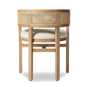Esta es la silla de comedor Four Hands Cordoba, que tiene una estructura de madera de teca maciza en un color natural con un respaldo tejido de ratán. - Product Image 4