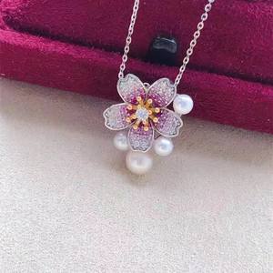 Ensemble de bijoux en perles d'eau douce de style fleur de cerisier, comprenant un pendentif, des boucles d'oreilles et une bague - Design artisanal - Product Image 3