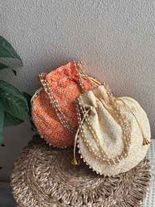 Sac à main artisanal AL MALIK CRAFT en coton, forme personnalisée, broderie de perles, motif floral, pompon, pour mariage et décoration intérieure - Product Image 1