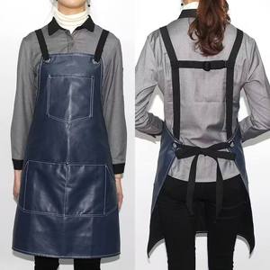 IKZARSA Delantal Profesional de Peluquería de PU Azul Oscuro con Tirantes Ajustables, Resistente al Agua, Duradero, Ecológico y Antiestático - Product Image 1