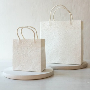 Handmade <b>White</b> Paper <b>Bags</b> for Luxury Cosmetics and Skincare Packaging Customized Handmade Paper <b>Bags</b> Stores and Salons Uses 2026 - Product Image 1