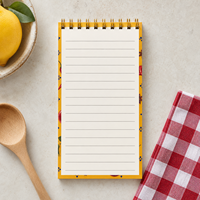 Bloc-notes spirale personnalisé LABON avec couverture jaune, motif grenades, citrons, piments, anis étoilé, étiquette bleue