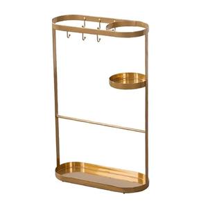 Elegante y bien hecho soporte para zapatos de metal dorado pulido que evita la formación de pilas de zapatos en toda la casa. - Product Image 1