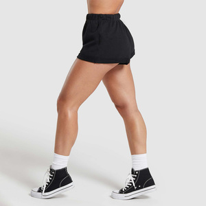 Shorts de sport noirs non tissés pour femmes, taille haute élastique, coupe régulière, respirants, séchage rapide, couleur unie, logo sur la jambe gauche, 100 % coton - Product Image 4
