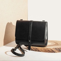 Sac à bandoulière en cuir véritable pour femmes LCS-0078B Style minimaliste petit sac à bandoulière Logo motif cuivre support pour téléphone fermeture éclair