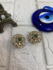 <b>studs</b> earring in round shape with green doublet and polki stone for Indian wedding jewelry <b>studs</b> in gold layered for women - Product Image 1