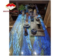 Pierre lumineuse de luxe, prix avantageux pour table à manger en granit bleu solide et bureau de réception en quartz Pandora, design translucide