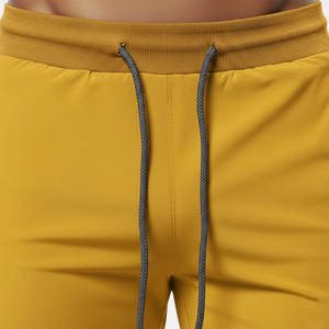 Shorts de sport jaunes unis pour hommes avec poches, taille à cordon de serrage, séchage rapide, en tissu tricoté, taille mi-haute, longueur courte, vêtements de sport - Product Image 5