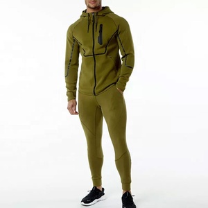 Pantalones activos ajustados de manga raglán de alta calidad personalizados para hombres, chándal de entrenamiento para correr con cremallera completa de Punchin Sports - Product Image 1