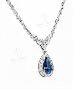 Elegant pendant <b>necklace</b> in 18K white gold with pear cut blue sapphire centerpiece classic halo of sparkling lab grown diamonds - Product Image 3
