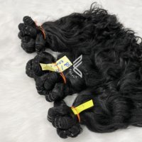 Paquets de cheveux ondulés vierges vietnamiens au prix le plus bas, trame de cheveux ondulés naturels vietnamiens pour femmes