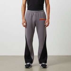 Pantalon de jogging décontracté surdimensionné pour homme en toile 100 % coton respirant avec logo imprimé DTG personnalisé sur les panneaux latéraux – Vente en gros - Product Image 1