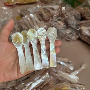 High quality artisanal black <b>shell</b> spoon with shimmering rainbow glow and custom logo engraving for luxury catering - Product Image 1