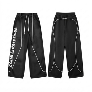 Pantalon coupe-vent réversible en coton 100% premium, noir avec panneaux à passepoil blanc, fermeture à cordon, style streetwear, pantalon d'automne - Product Image 1