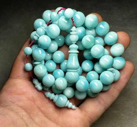 Chapelet musulman artisanal éco-responsable en résine, perles d'ambre et turquoise, bijou de prière religieux