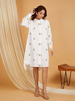 Robe chemise blanche brodée de fleurs, à manches longues et col rabattu, coupe ample, longueur midi, en coton tissé, pour un usage quotidien décontracté