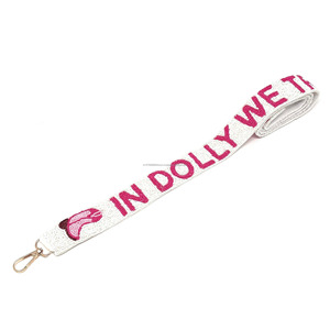 In Dolly We Trust Sangle de sac perlée en tissu avec broderie rose, accessoire de sac tendance - Product Image 2