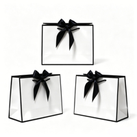 Sacs cadeaux élégants en papier noir et blanc avec nœud en satin, pour bijoux de luxe ou cadeaux de mariage, utilisables en supermarché