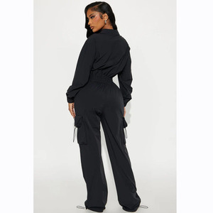 Survêtement noir ample pour femme avec col zippé et poches latérales, style streetwear décontracté - Product Image 2
