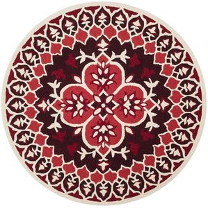 Tapis artisanal rouge, design naturel et organique, forme arrondie, antidérapant, adapté aux animaux domestiques, à poils longs, pour salon, chambre et décoration intérieure. - Product Image 1