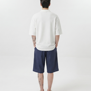 Ensemble décontracté d'été pour homme : Polo blanc en coton à col rabattu et short bleu marine coupe ample - Product Image 2