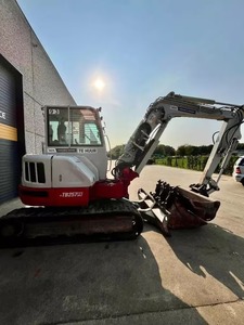 Mini-excavatrice Takeuchi TB257FR haut de gamme, design compact, performances hydrauliques puissantes pour les travaux de construction, de terrassement et de chantier. - Product Image 1