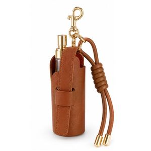 Llavero de cuero PU personalizado con mini botella de perfume y colgante para bolso - Product Image 1