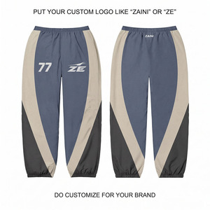 Pantalon coupe-vent réversible en coton premium 90 GSM, design à empiècements bleu marine, beige et noir, fermeture à cordon, streetwear, léger, sport - Product Image 1