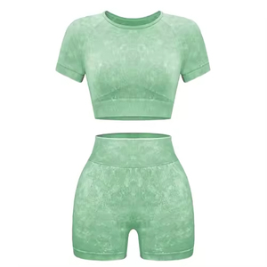 ชุดโยคะไร้รอยต่อ 2 ชิ้น เสื้อครอปเอวสูงและกางเกงขาสั้น สีพื้น คอกลม แขนสั้น ผ้าสแปนเด็กซ์ โพลีเอสเตอร์ ชุดกีฬาสำหรับผู้หญิง - Product Image 1