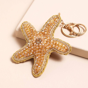 Llaveros y adornos para bolsos de lujo con bordado de estrellas con cuentas, hechos a mano. - Product Image 1