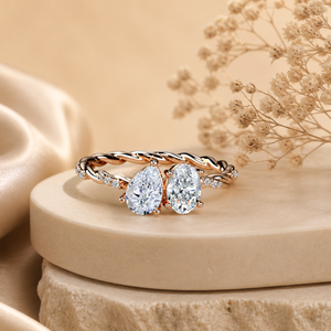 Anillo de compromiso de oro rosa con pavé retorcido y diamantes de moissanita de corte pera y ovalado de 1 quilate |   Anillo de novia único con doble piedra - Product Image 1