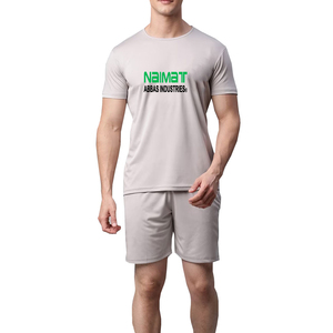 ชุดเสื้อยืดคอกลมสีเทาและกางเกงขาสั้นสำหรับผู้ชายจาก Naimat Abbas Industries แห้งเร็ว สวมใส่สบายในฤดูร้อน พิมพ์ลายโลโก้ด้านหน้า - Product Image 1