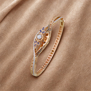 ladies bangle featuring a curved floral motif with blue accents stylish womens jewellery lightweight designer <b>bracelet</b> - Product Image 3