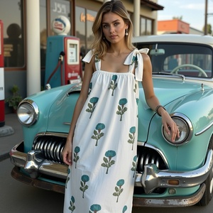 White cotton summer maxi featuring a flowy silhouette pastel blue <b>green</b> <b>floral</b> pattern <b>tie</b> up shoulders and a crisp square - Product Image 1