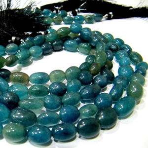 Perles ovales lisses en quartz saphir bleu teinté, vendues par brin de 13 pouces de long - Product Image 1