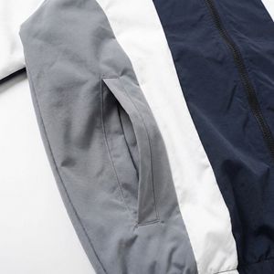 Chaqueta Deportiva Color Gris Marino y Blanco — Chaqueta Ligera con Cierre y Detalles de Paneles y Dobladillo Elástico |   Unisex OEM/ODM Marca Privada - Product Image 4