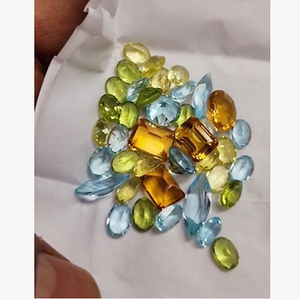พลอยซิทรินบลูโทแพซเพอริดอตธรรมชาติ 39 เม็ด ขนาด 7x5 10x8 มม. รูปไข่เหลี่ยม 8 เหลี่ยม น้ำหนัก 48 กะรัต คุณภาพขายส่งจาก Iroc ราคา 148 ดอลลาร์สหรัฐ - Product Image 1