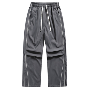 Pantalon de survêtement élégant pour homme, coupe ample et large, avec empiècements contrastants noir et blanc, taille à cordon de serrage, confortable pour le quotidien - Product Image 1