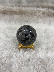 Yooperlite <b>sphere</b> with smoky gray stone body vibrant orange fluorescent glow polished curvature and distinctive mineral display - Product Image 2